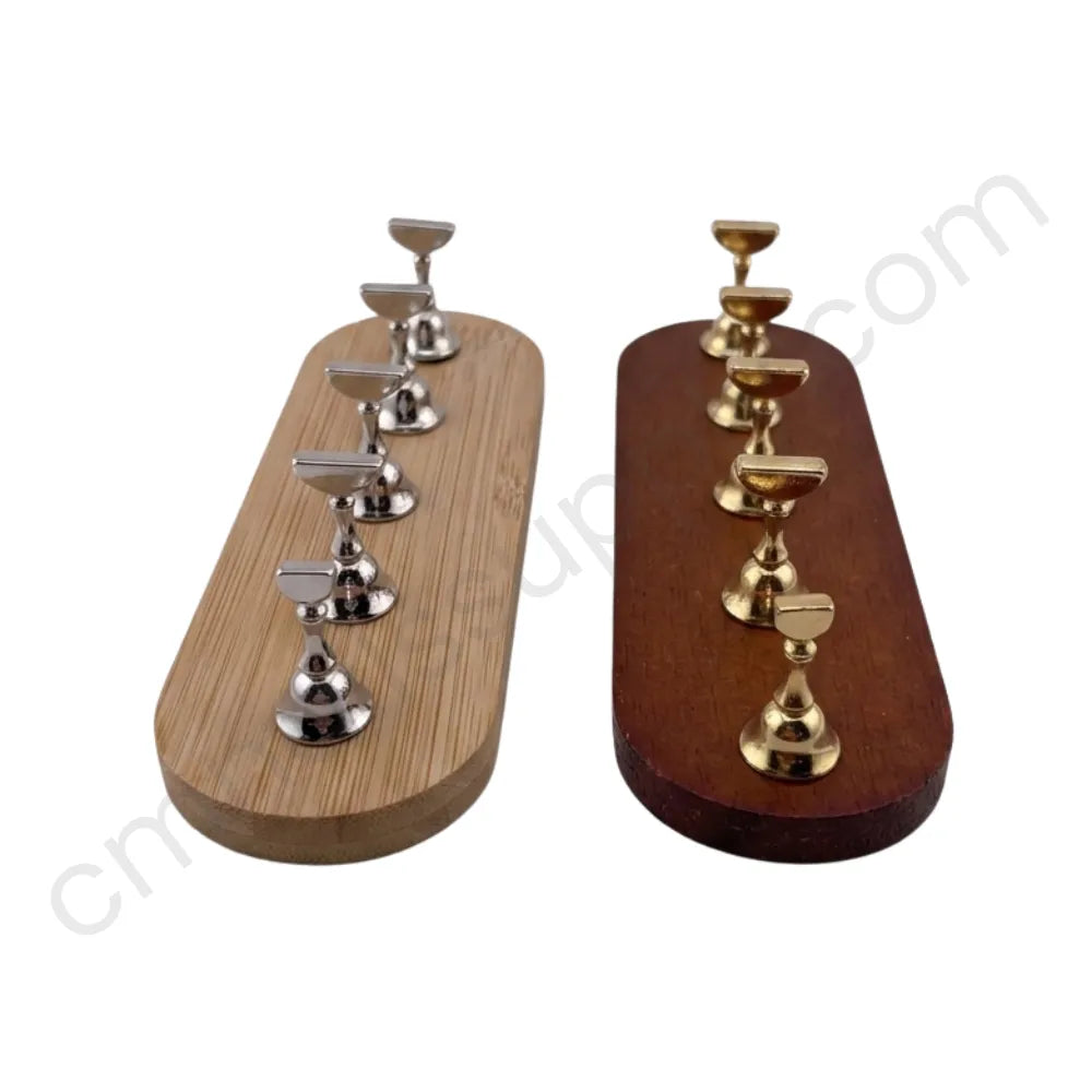 Two wooden press on stands with metal stands on a white background