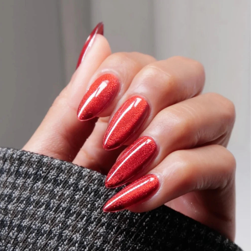 Cat eye nail magnet hovering over wet Feisty Paws gel polish to create signature cat eye effect