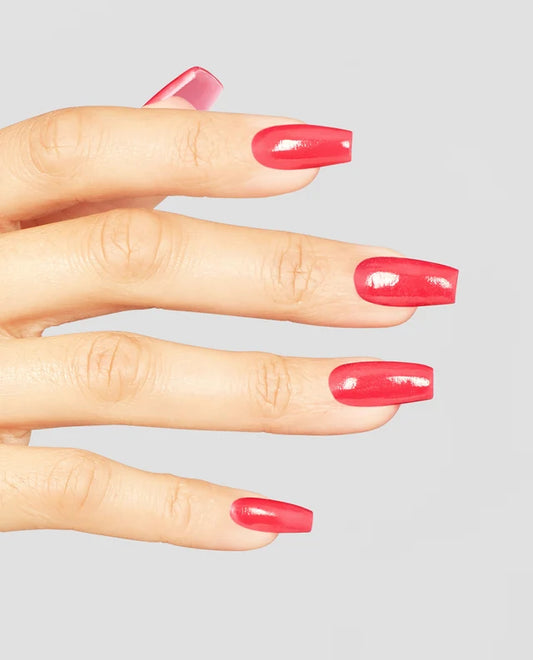 Hand with OPI Nail Lacquer Charged Up Cherry in a vibrant hot pink shade, on a light gray background