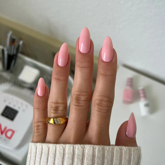 Back facing manicured hands wearing DND Pink Bubble #8686 sheer porcelain pink gel polish
