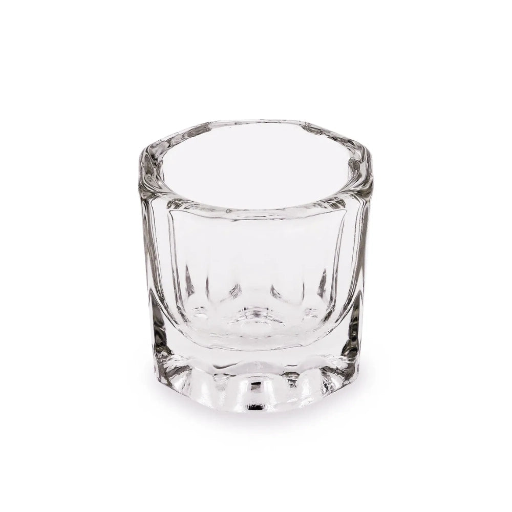 Clear glass dappen dish on a white background