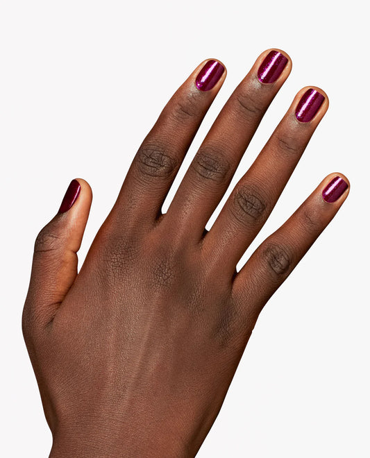Gel manicure on natural nails displaying OPI GelColor Lincoln Park After Brunch blackberry purple shimmer glossy finish.