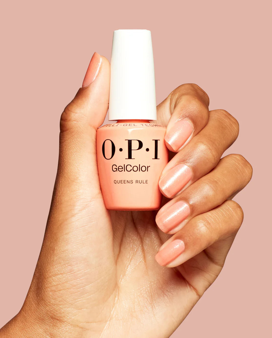 Gel manicure on natural nails displaying OPI GelColor Queens Rule peach shimmer glossy finish and radiant coverage.