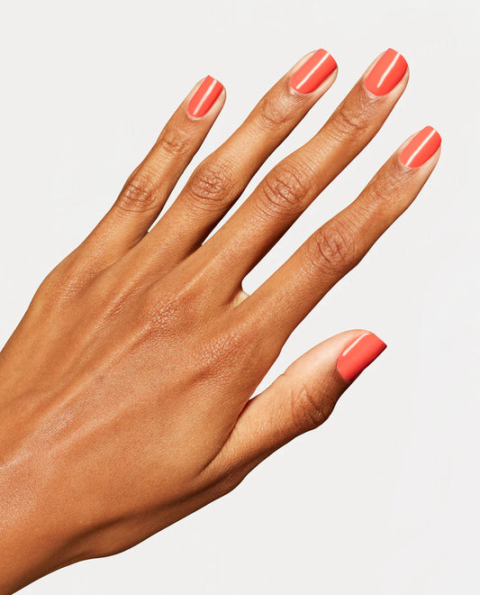 Gel manicure on natural nails displaying OPI GelColor Shrimp Cocktail bright orange crĆØme glossy finish and bold coverage.