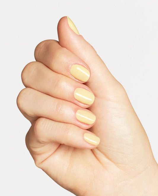 Gel manicure on natural nails displaying OPI GelColor Sunny Bunny butter yellow crĆØme glossy finish and even coverage.