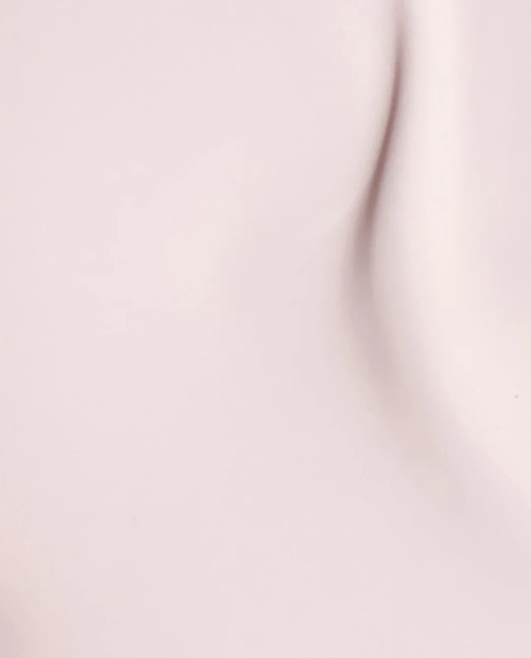 Light pink crème nail polish swatch on tips showing OPI Pink In Bio S001 opacity and finish.