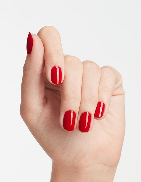 Glossy Big Apple Red manicure on natural nails with chip-resistant finish