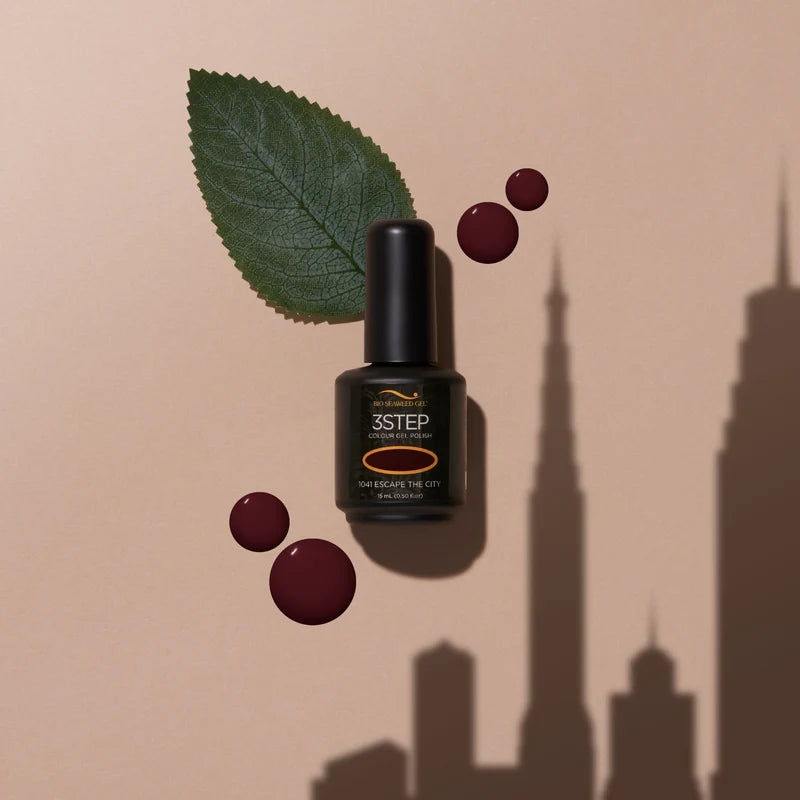 Close up manicure shot of 1041 Escape the City black cherry nail polish on natural nails, showing the color depth and shine.