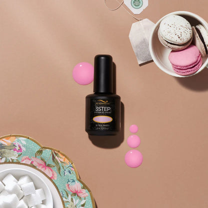 Nail polish bottle tea party with pink polka dots on a beige background