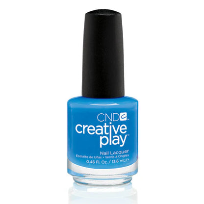 A bottle of CND Creative Play CND Creative Play Nail Polish - #493 Aquaslide nail lacquer in a bright medium blue shade, featuring a black cap and white text on the label, set against a plain white background with a soft reflection below.