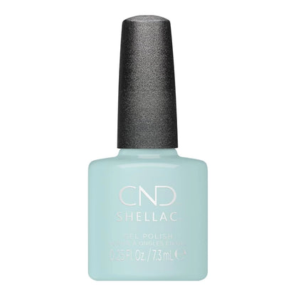 A bottle of CND Shellac gel nail polish CND Shellac Taffy gel polish in a pale icy blue shade, featuring a textured dark gray cap, on a solid white background.
