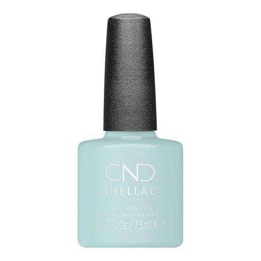 A bottle of CND Shellac gel nail polish CND Shellac Taffy gel polish in a pale icy blue shade, featuring a textured dark gray cap, on a solid white background.