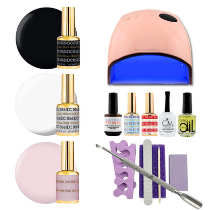 A gel polish starter kit arranged on a white background, including three shades of DC DND gel nail polish (black ocean, white chalk, soft pink), a UV nail lamp, primers, CM nail monomer, cuticle Oil, a nail file, a purple buffer pedicure kit, and metal tools.