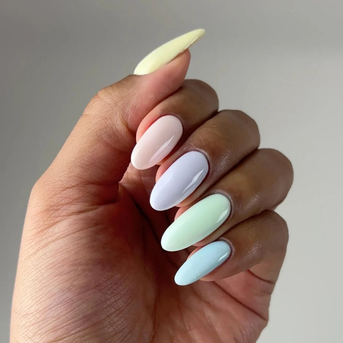 Manicured nails painted with DIVA Lather Me Up sky blue pastel gel polish