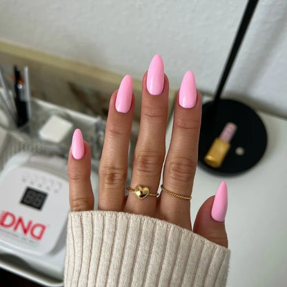 Bright neutral pink gel manicure painted with DND DIVA Pink Ribbons on natural nails