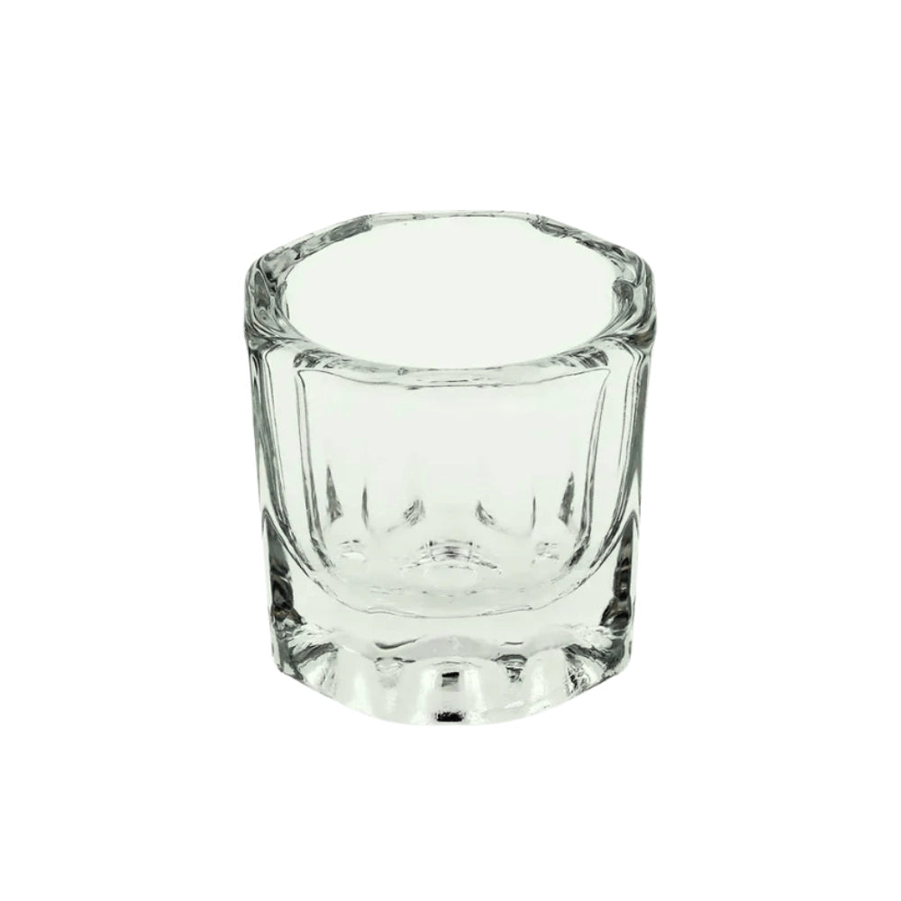 Clear glass dappen dish on a white background