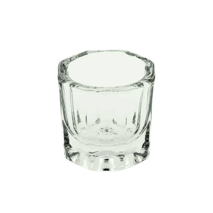 Clear glass dappen dish on a white background
