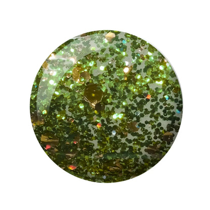 A circular close-up of a glittery green cosmetic or resin surface filled with fine and chunky green glitter, shown on a plain white background.