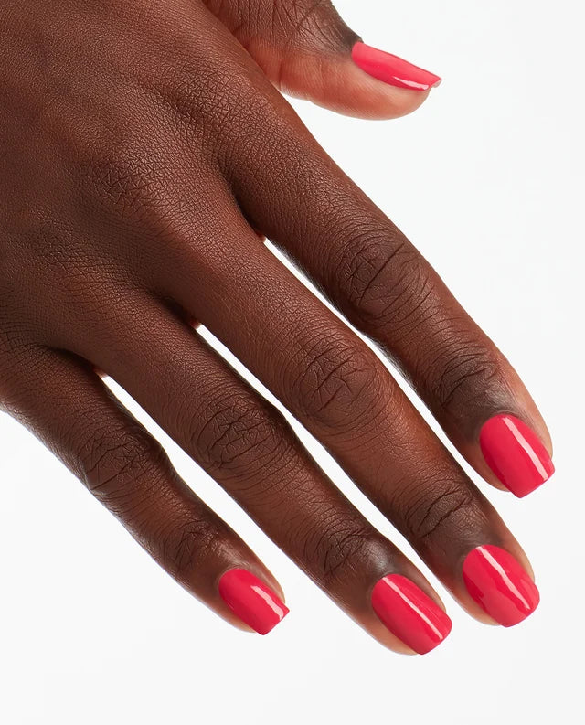 Hand with pink nail polish on a white background OPI Nail Lacquer Charged Up Cherry in a vibrant hot pink shade