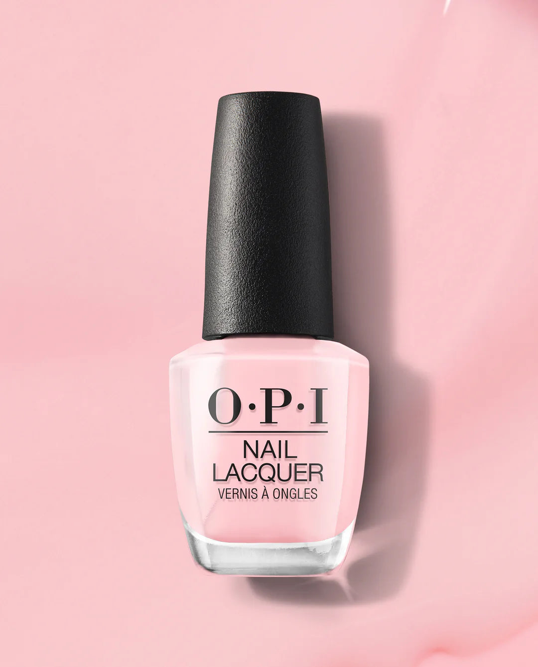 OPI it's a girl nail polish bottle on a pink background