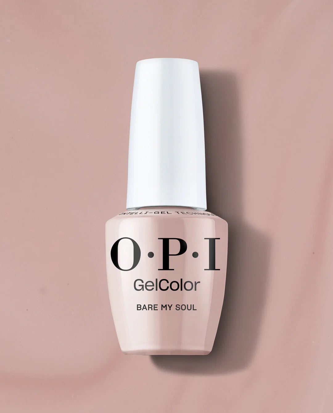 An OPI GelColor nail polish bottle in the shade 'Bare My Soul', featuring a pale pinkish-beige color and a white cap, set against a matching dusty pink background.