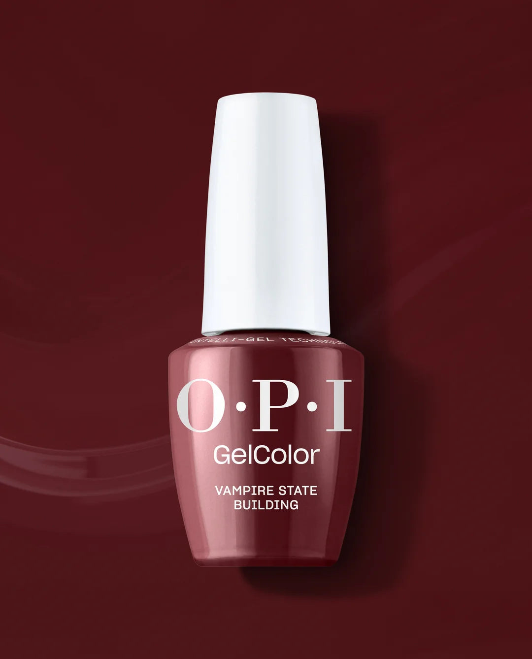 An OPI GelColor nail polish bottle in the shade 'Vampire State Building', featuring a deep burgundy color and a white cap, set against a matching dark burgundy background.