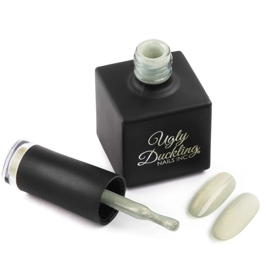Nail polish bottle with applicator and nails painted in a light green colour Ugly Duckling Gel Polish Keeper 347 