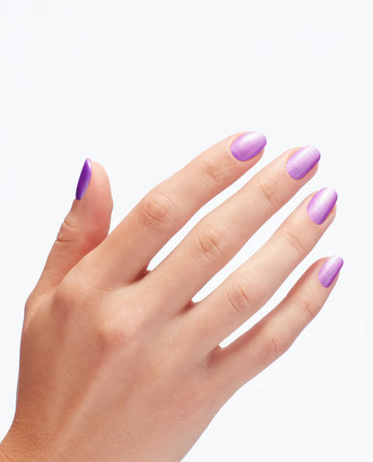 Hand with purple nail polish on a white background