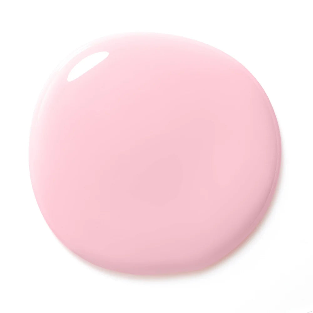 Sheer pink Builder X gel swatch on nail tip showing natural coverage and color.