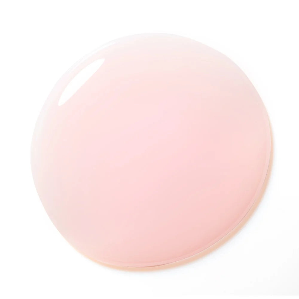 Sheer pink builder gel swatch on nail tip showing natural pink coverage and translucency.