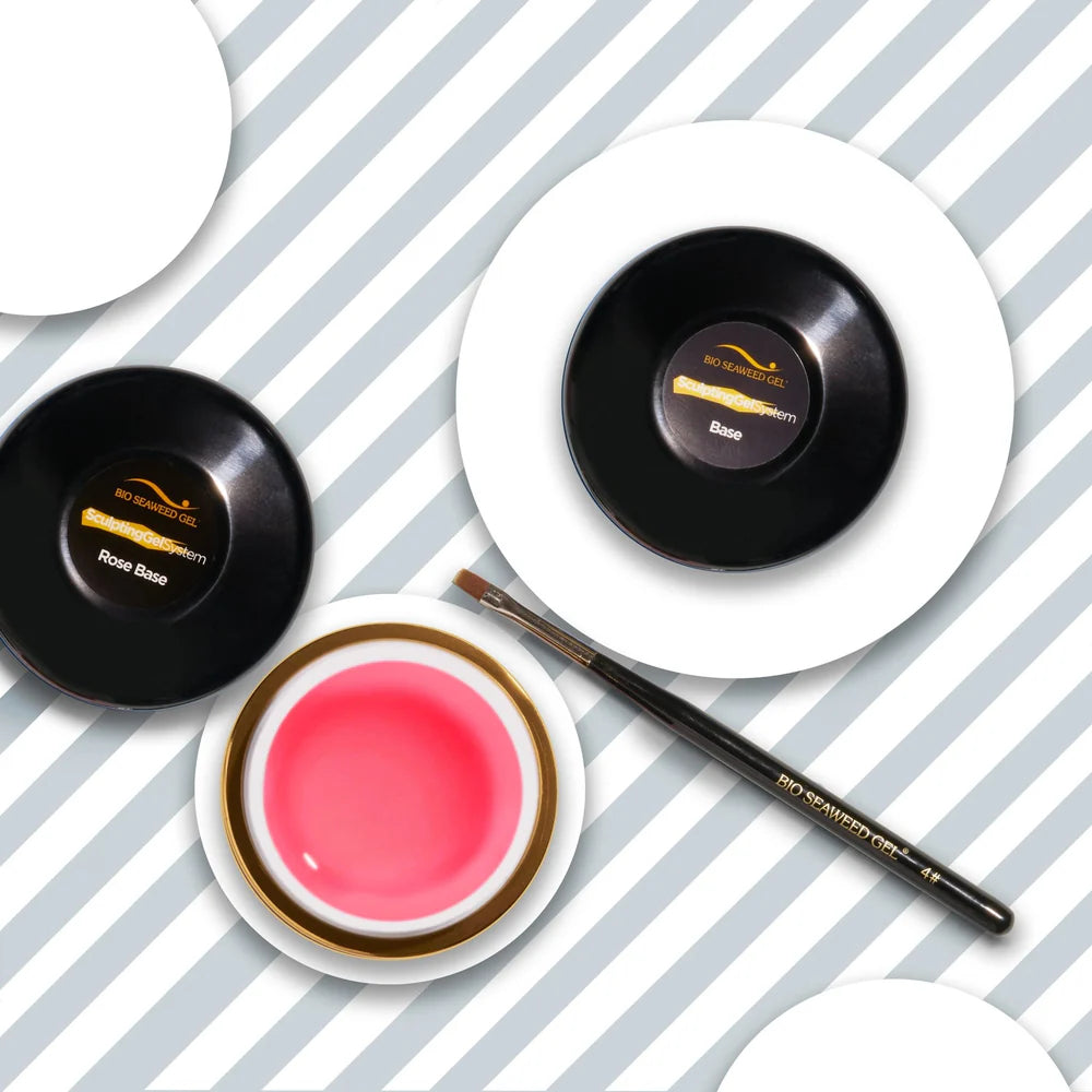 Nail technician applying Bio Seaweed Gel rose base gel during overlay strengthening service.