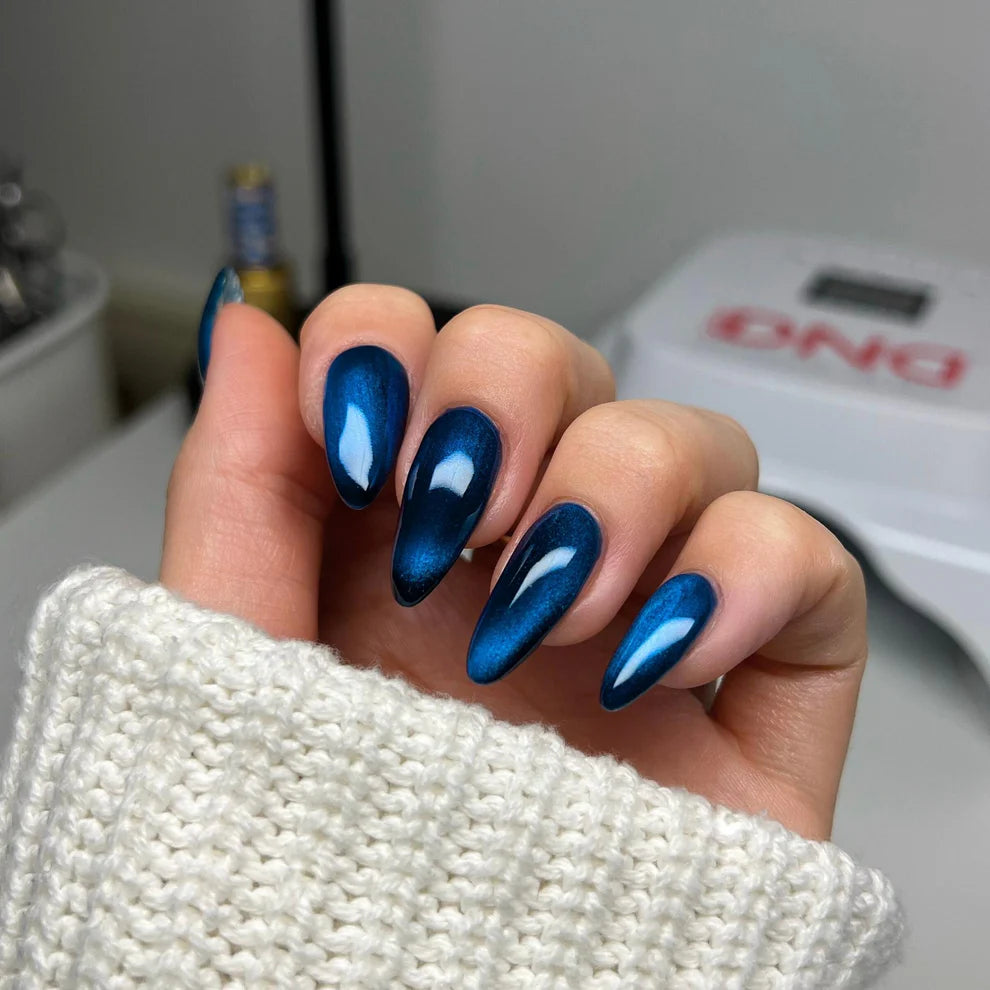 Cat eye nail polish gel application showing Loyal To You metallic shimmer and magnetic particles for cat eye nails