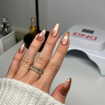 Complete cat eye nails manicure showcasing Tiger Eyes cat eye gel polish Canada with magnetic shimmer effect