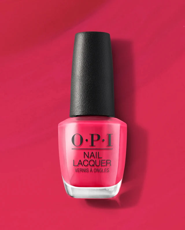 A bottle of OPI Nail Lacquer Charged Up Cherry in a vibrant hot pink shade, set against a matching hot pink background with a soft shadow.