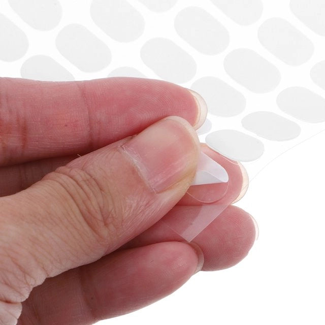 Clear adhesive dots for nail art display and nail tip holder close up