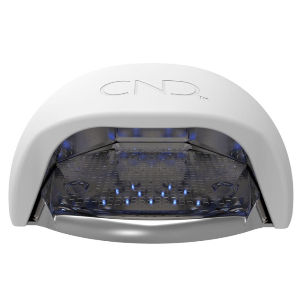 Removable tray being lifted out of CND LED Lamp for easy cleaning and sanitation