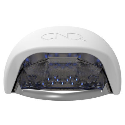 Removable tray being lifted out of CND LED Lamp for easy cleaning and sanitation