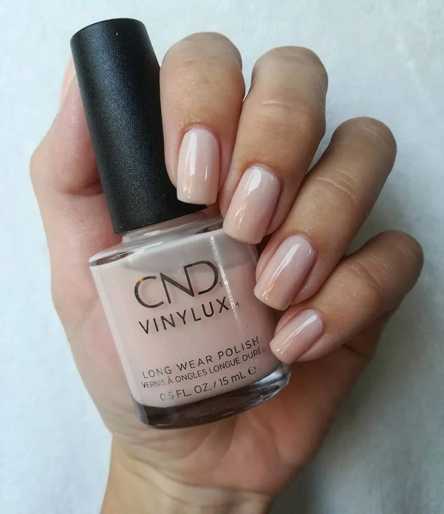 CND VINYLUX #319 Bouquet sheer milky pink nail polish for elegant bridal manicures.
