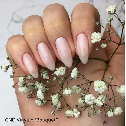 CND VINYLUX Bouquet #319 sheer pink nail polish for French manicure bases and natural nail looks.