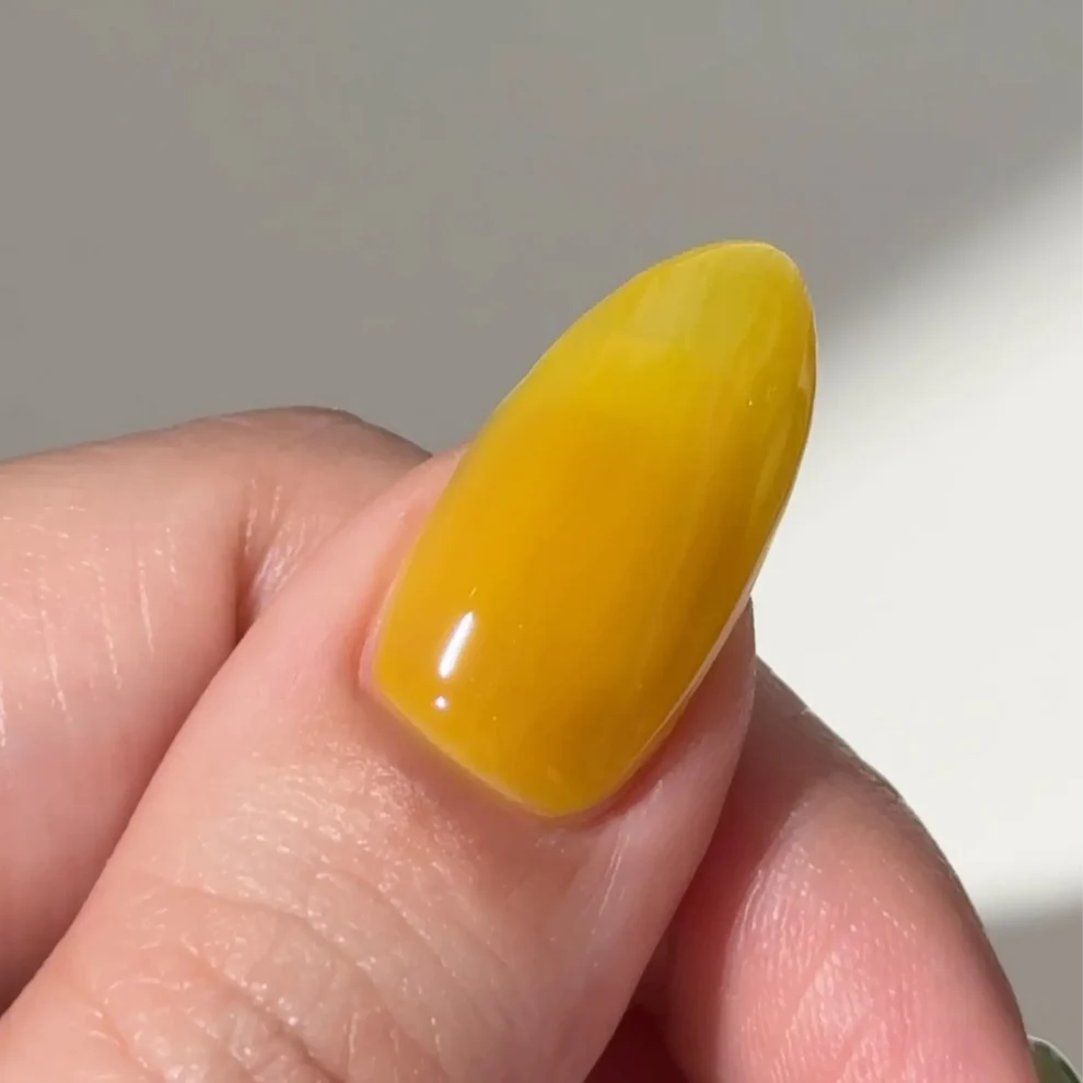 DC Jelly #03 Yuzu colour swatch showing a true lemon yellow jelly gel polish shade.