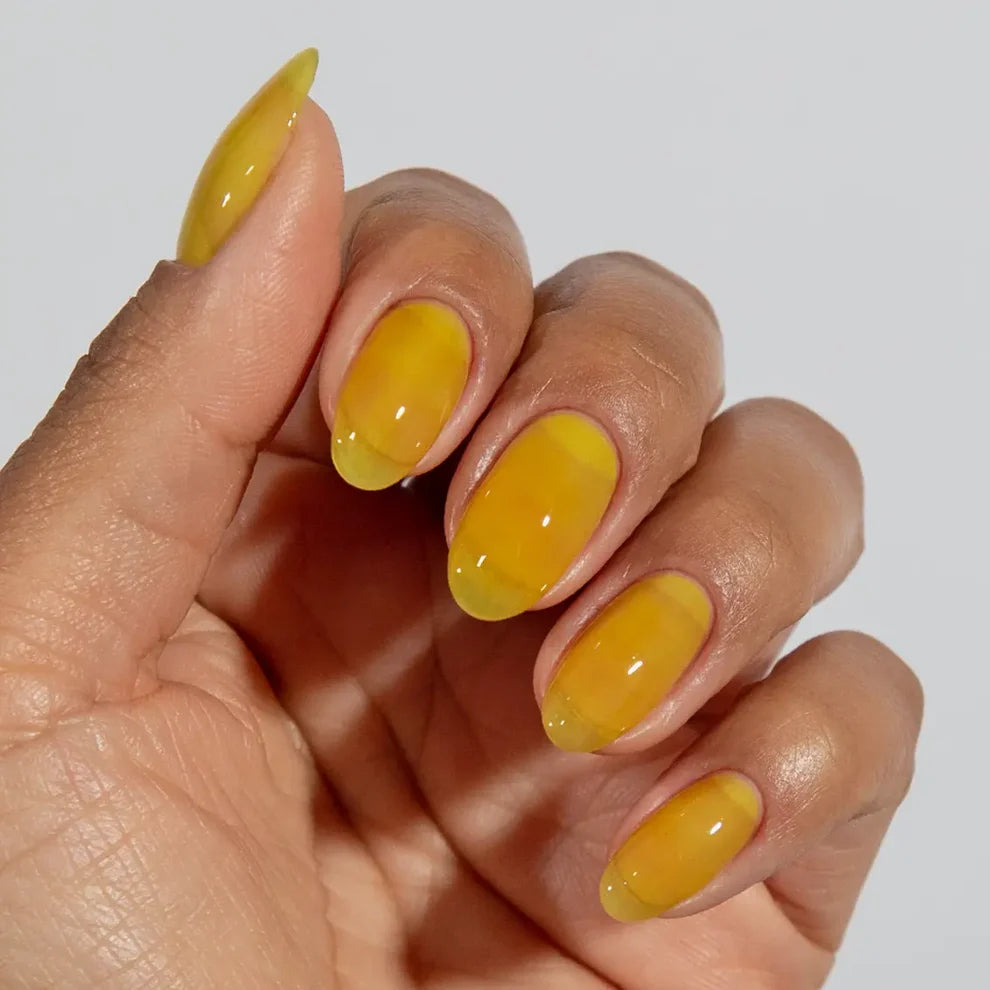 DC Jelly #03 Yuzu jelly nail polish bottle in a true lemon yellow shade.