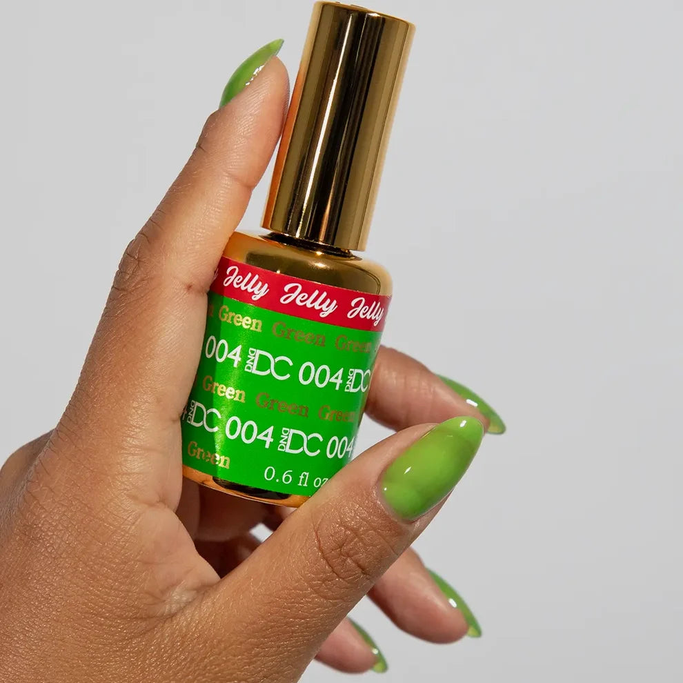Close-up manicure showing DC Jelly #04 Green jelly nail polish with a fresh apple green finish.