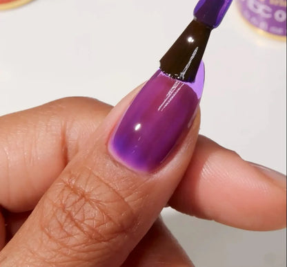 Manicured hand with DC Jelly 019 Iris jelly gel polish applied to show the finished salon style manicure