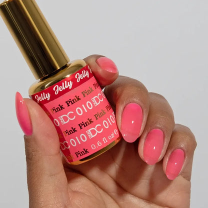 Close up of the DC Jelly nail polish bottle in the Pink shade with brush cap and label visible