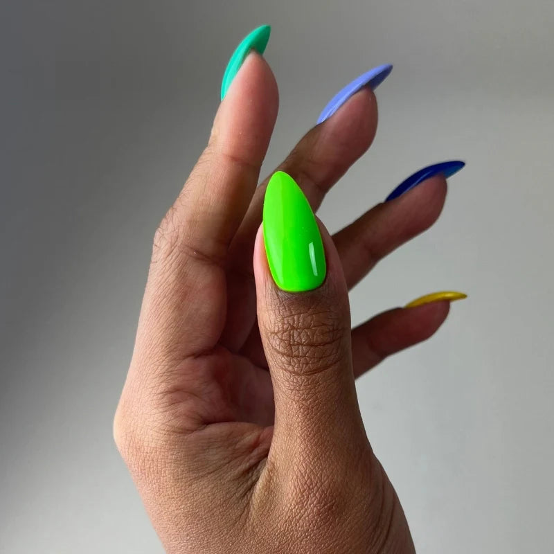Close up manicure detail showing DIVA #190 Tokyo Tea neon green gel polish around cuticle area
