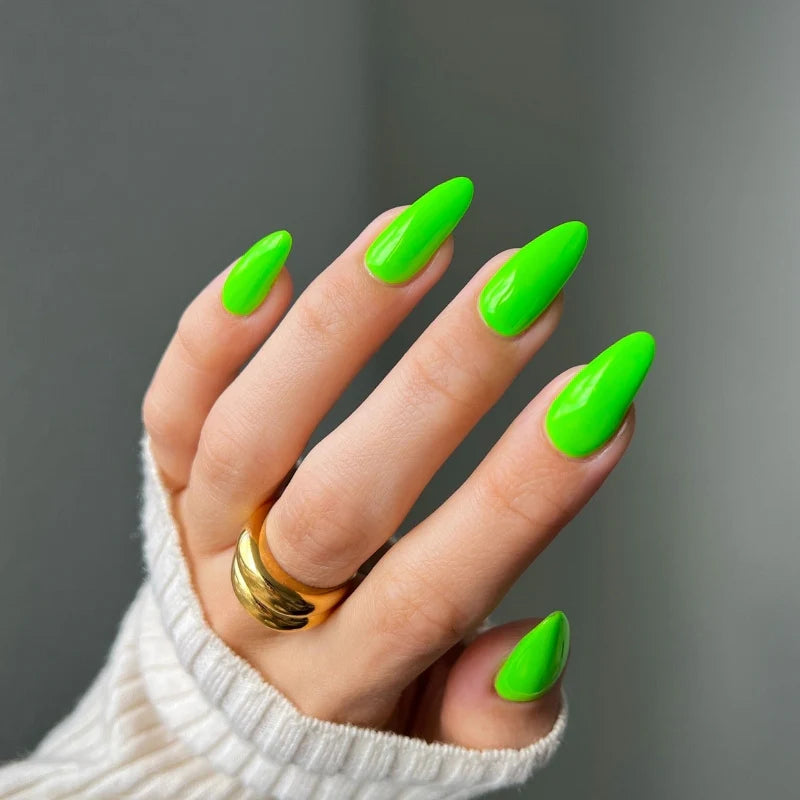 Manicured hands wearing DIVA #190 Tokyo Tea neon green gel polish front angle glossy salon finish