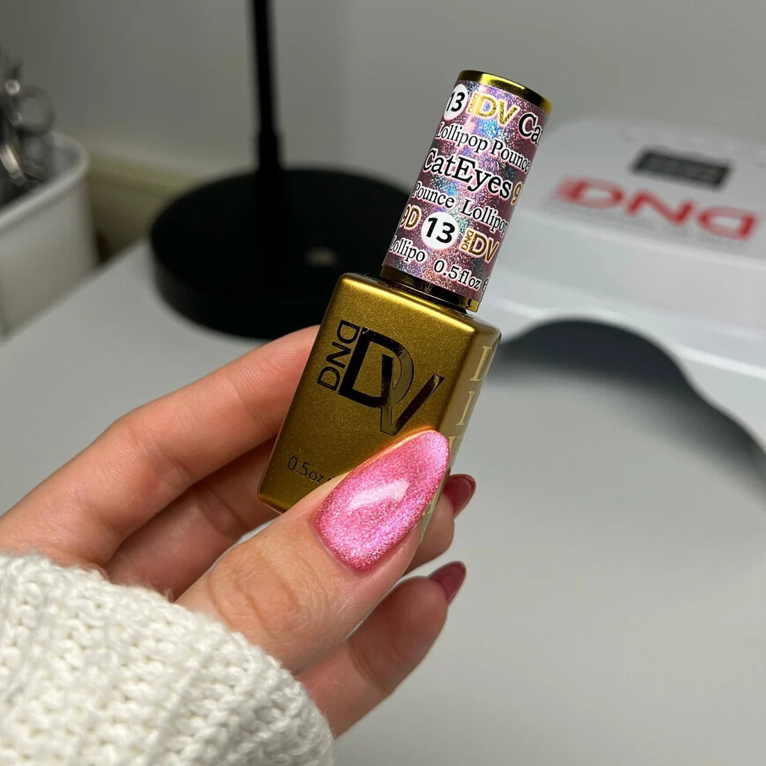 Full manicure in DIVA 9D Cat Eye Candy #13 Lollipop Pounce, showing the carnation pink cat eye nail polish finish on natural nails.