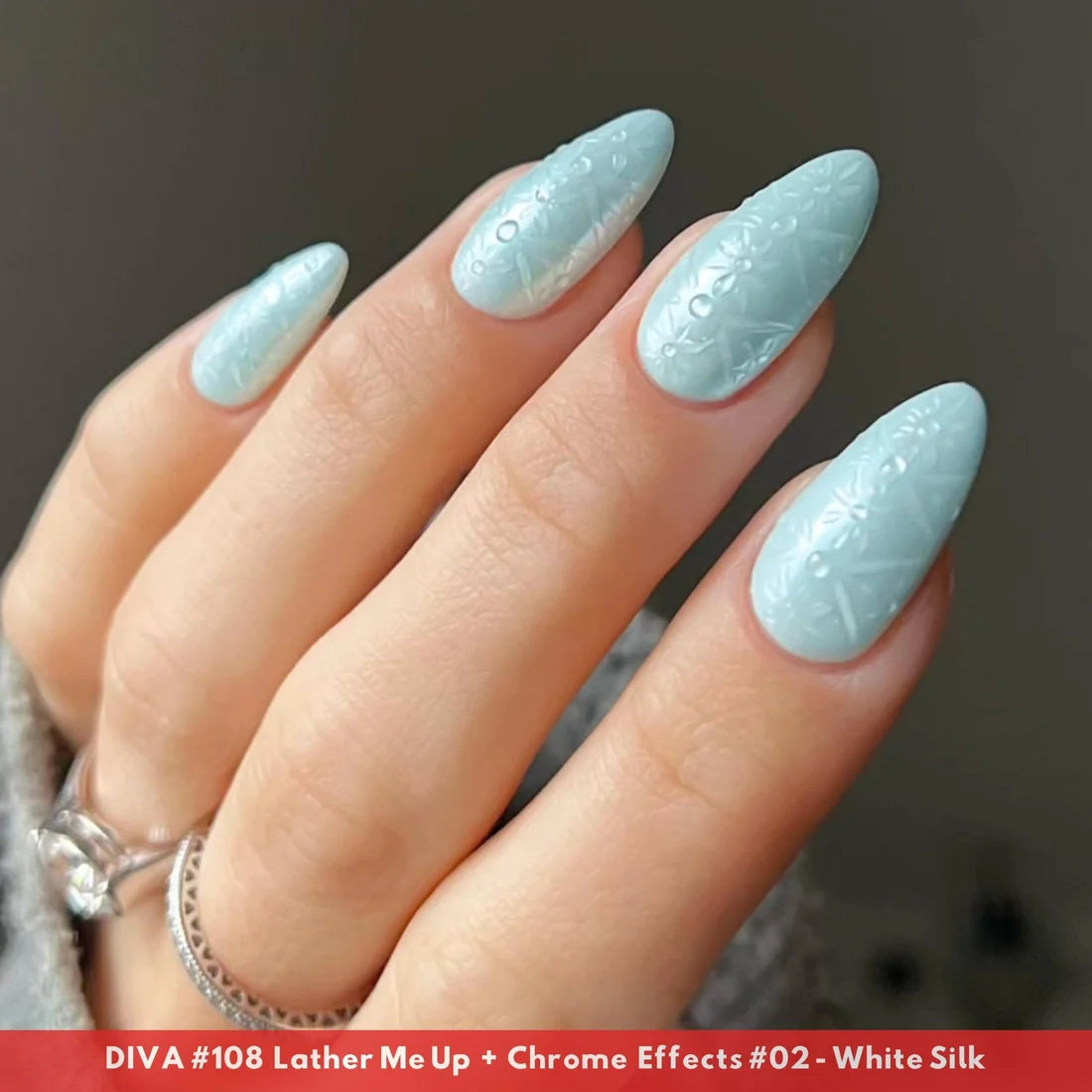 Close up of manicured hand with DIVA Lather Me Up pastel blue gel nails