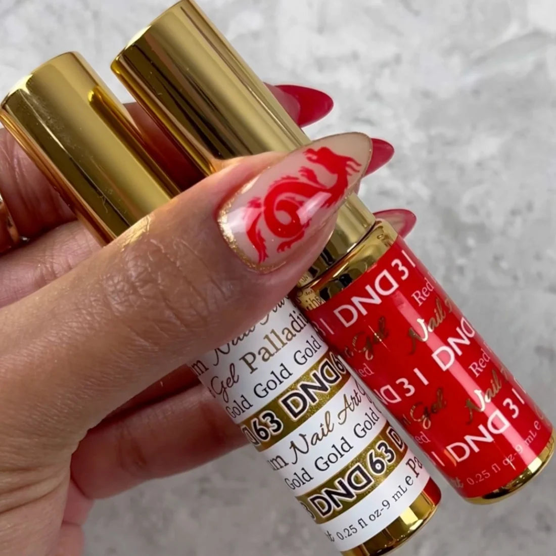 DND Palladium Gold gel liner beside a nail art design in metallic gold