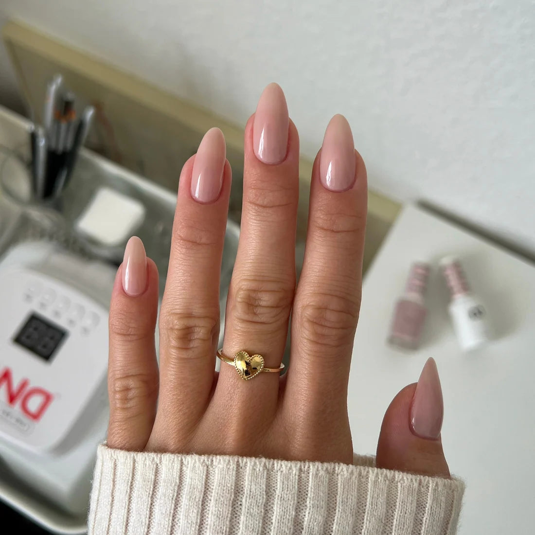 Full hand manicure in DND Bare Neutral 2345 sheer taupe polish for an everyday natural nail look